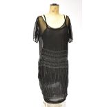 A circa 1920s jet slip and over dress with butterfly sleeves, length 117cm.