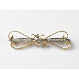An 18ct gold ribbon-style brooch,