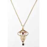 An Edwardian Art Nouveau style 9ct yellow gold pendant set with garnets and seed pearls, approx 2.