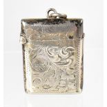 A late 19th century silver vesta case decorated with an all-over scroll and floral pattern,