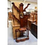 A 19th century mahogany hall stand with central column with four outswept branches,