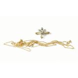 A Fleur De Lys brooch set with diamonds and a fine link chain necklace, clasp marked 375 (2).