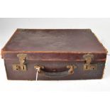 A small vintage brown suitcase containing a quantity of Victorian,