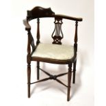 An Edwardian mahogany and satinwood strung corner chair,