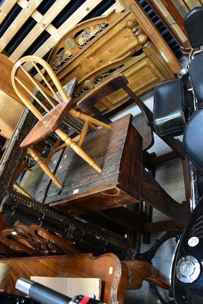 An early 20th century school desk with integral chair and hinged writing slope,