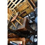 An early 20th century school desk with integral chair and hinged writing slope,