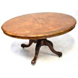 A Victorian inlaid burr walnut oval tilt-top loo table with central floral motif,