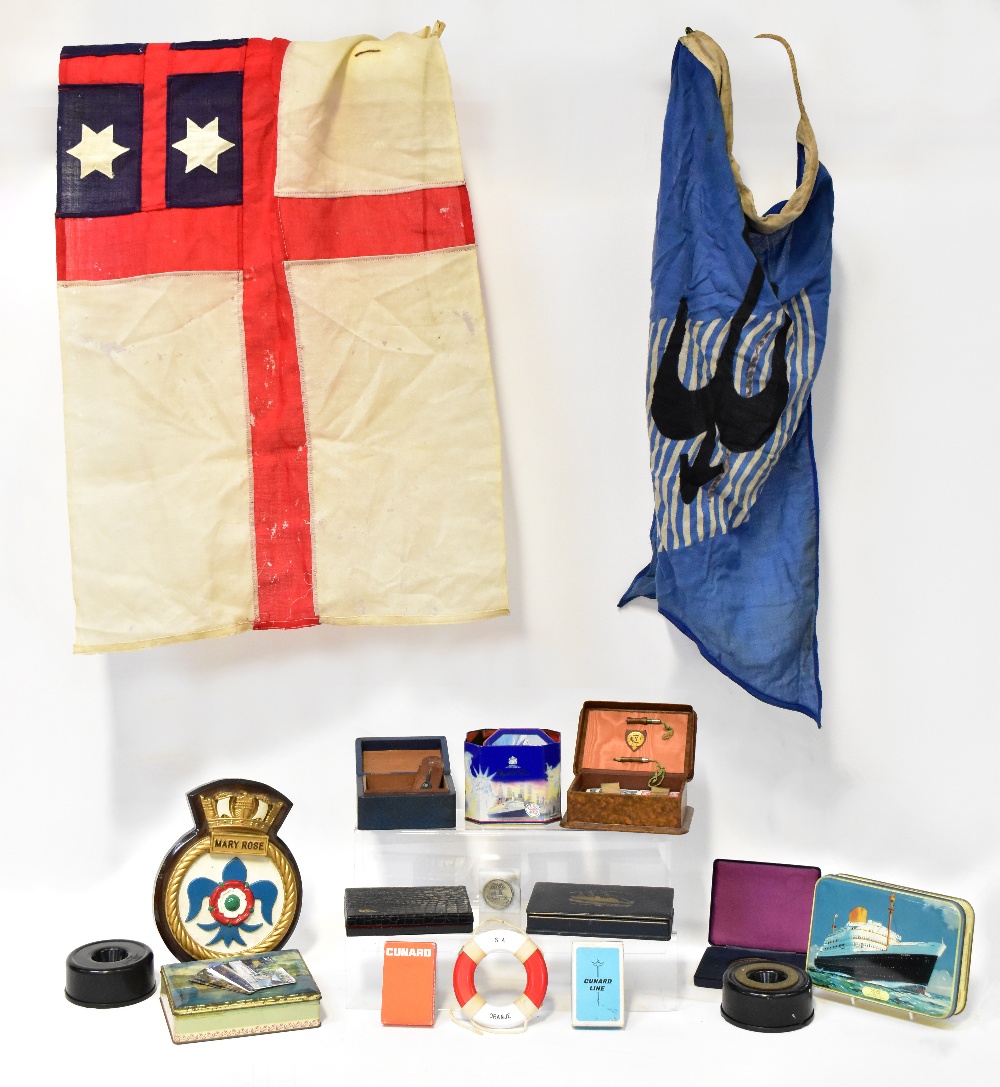 A quantity of maritime collectibles to include two signal flags, a Stratton compact,