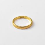 A 22ct gold band ring, size P, approx 3.1g.