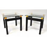 A pair of modern stylised glass top bedside/occasional/coffee tables,