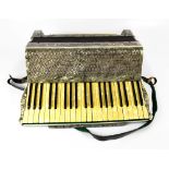 HOHNER; a cased vintage accordion with mother of pearl effect keys and grey marbled case,