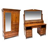 An Edwardian two-piece oak bedroom suite comprising a double wardrobe,