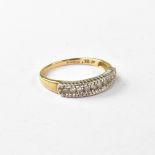 A 9ct gold and diamond half eternity ring, with a line of ten small diamonds approx .