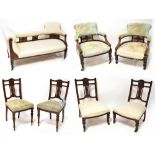 An Edwardian walnut framed harlequin nine-piece salon suite comprising chaise longue,