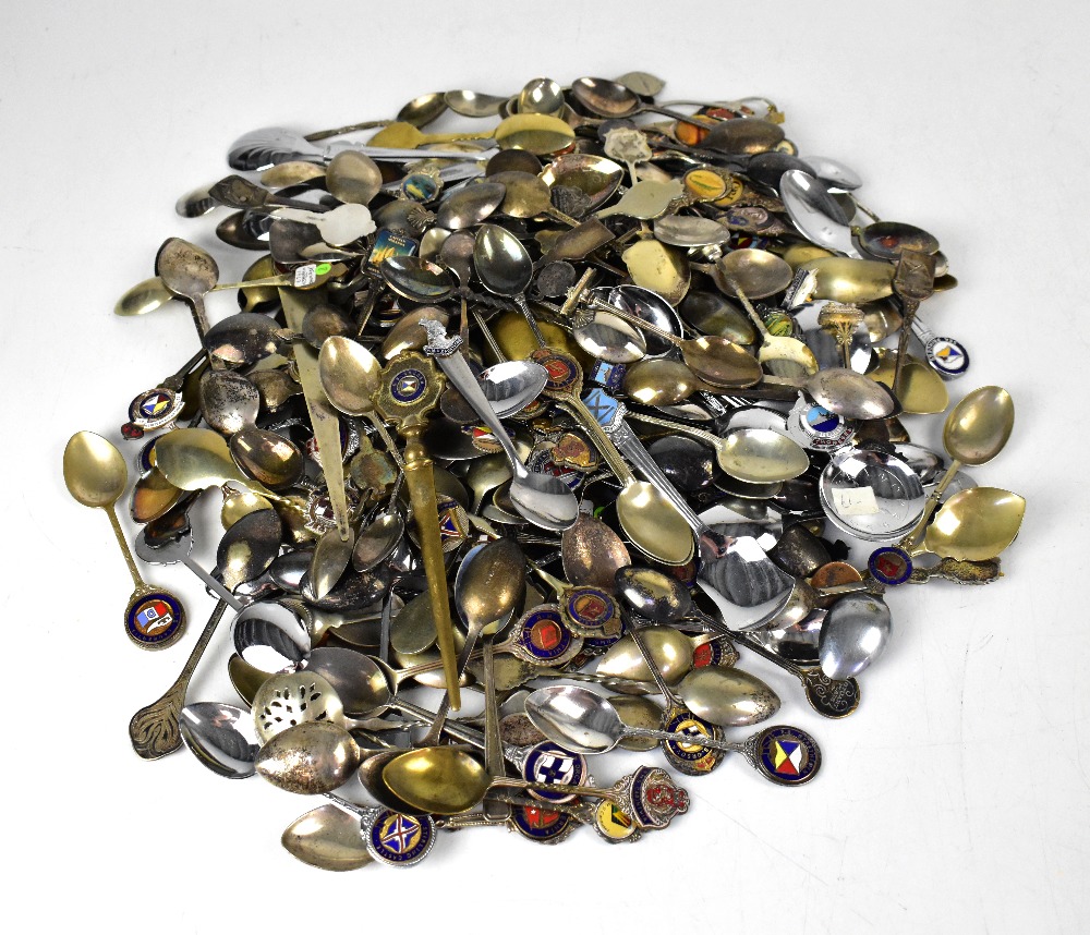 A group of over one hundred and fifty white metal and enamelled collectors' spoons relating to