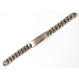 A silver heavy set ID bracelet inscribed 'G.N.H.', approx 4ozt (af).