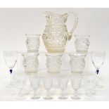 A collection of mostly clear drinking glasses to include a large 19th century pressed and cut glass