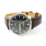 SEIKO; a modern gentlemen's stainless steel 'Kinetic' calendar wristwatch with green dial,
