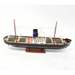 A scratch-built model of a steamship, black hull with painted decks and bridge,
