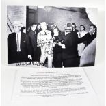 A reproduction black and white photograph depicting the moment that Jack Ruby shot Lee Harvey