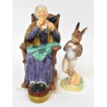 ROYAL DOULTON; two figures comprising HN2352 'A Stitch in Time', also HN2108 'Baby Bunting' (2).