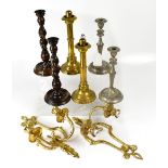 A pair of silver plated candlesticks, a pair of oak barleytwist candlesticks,