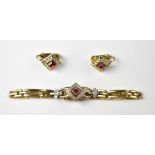A yellow metal bracelet and matching clip earrings,