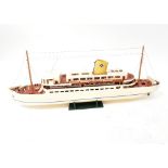 A scratch-built model of a yacht, painted cream and with varnished wooden decks,