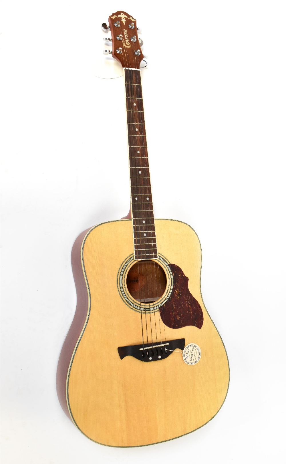 A Crafter acoustic guitar.