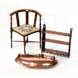 An Edwardian mahogany corner chair with string inlay, curved back and panelled supports,