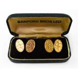 A pair of gentlemen's 9ct gold oval cufflinks, with bright cut floral decoration,