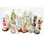 A group of vintage and modern collectible figures,