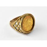 A gentlemen's coin inset gold signet ring,