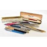 A collection of various ballpoint and fountain pens to include a Parker 61,