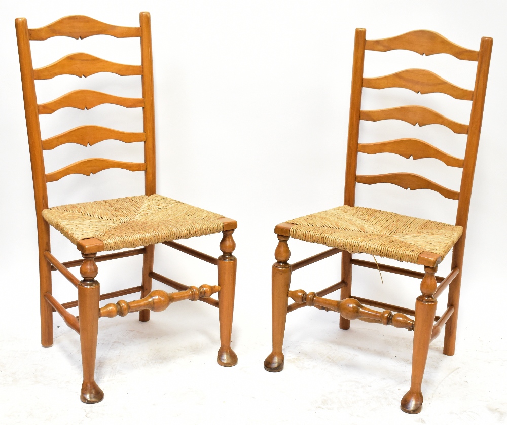 A set of six light oak reproduction Lancashire ladder back chairs,