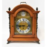 SCHMECKENBECHER; a reproduction mahogany cased chiming bracket clock with brass dial, dome top,