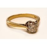 An 18ct yellow gold diamond solitaire ring, the round brilliant cut stone approx 0.