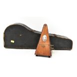 A vintage cased banjo ukulele with wooden body and eight strings, length 54cm, in travel case,