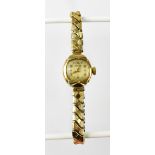 ROTARY; a ladies' vintage 9ct gold watch, the square silvered dial set with Arabic numerals,