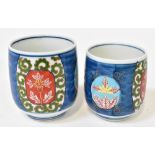 Two 20th century Japanese beakers with coloured enamelled panels of floral scenes,