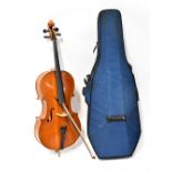 A cased cello with two-piece back.