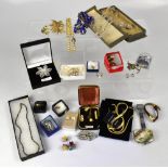 A quantity of costume jewellery to include brooches, necklaces, ear studs, pearls, watches, etc.