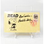 CHARLES SCHULZ; a Snoopy envelope dated 1984,