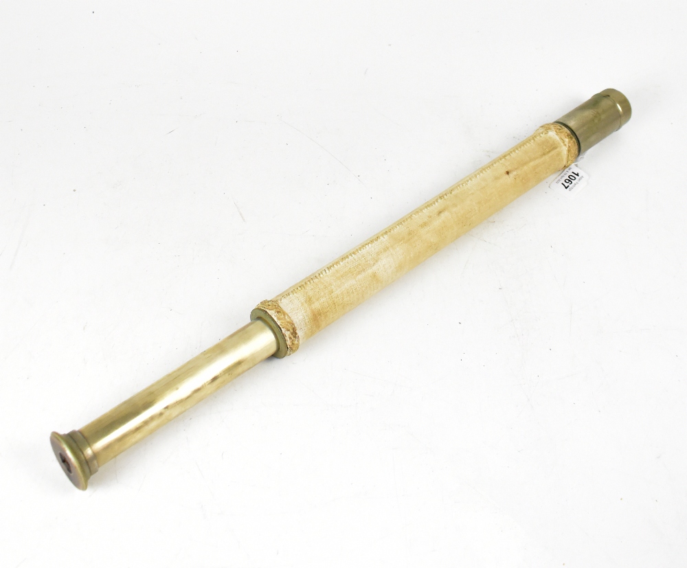 An early 20th century canvas covered single-drawer telescope inscribed 'G.