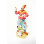 BESWICK; a rare clown/Harlequin figure with performing dog, model no.1086, height approx 18cm.