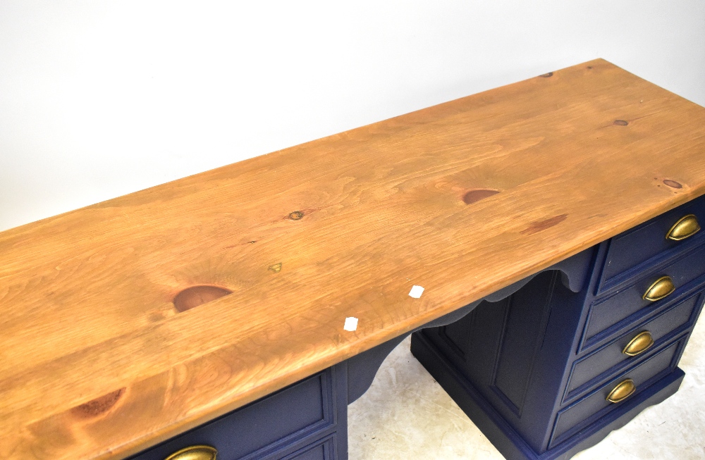 A twin pedestal desk with varnished top and painted blue base, each pedestal with four drawers, - Image 2 of 2