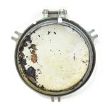 An early 20th century brass verdigris ship's porthole, diameter including fittings 51cm.
