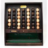 REMY MARTIN COGNAC; 'Le Passe Temps' wooden ball bar game (similar to 'Connect Four'),