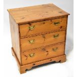 A modern pine chest of three drawers, with brass swing handles, on bracket feet, 81 x 76 x 56cm.