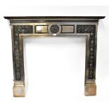 A metal brass-effect fire surround in the Victorian style with Neo-Classical style urns with grape